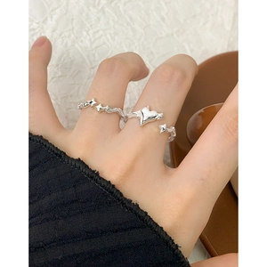Silver S925 star and heart ring set shown on finger with minimalist layered design