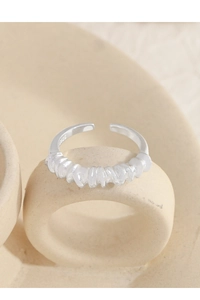 Detailed close-up showing the S925 hallmark on an irregular spiral silver ring