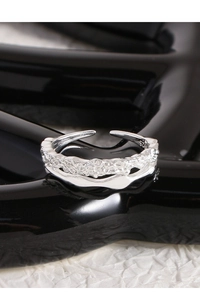Macro detail of S925 sterling silver double-layer ring with textured lava finish