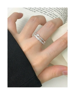 Detailed view of 925 sterling silver layered rings with pavé cubic zirconia accents