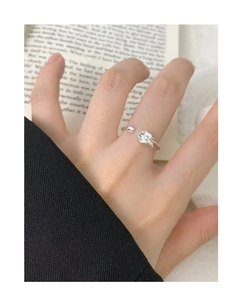Detailed view of an S925 silver adjustable ring featuring a carved rose bud design