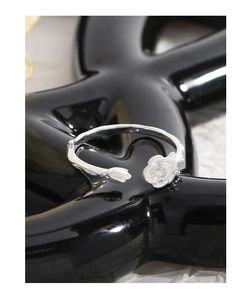 Detail shot of a S925 silver open ring featuring a rose flower and bud on a twig band