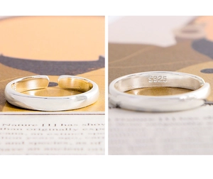 Detail view of S925 sterling silver stamp on minimalist polished open ring band