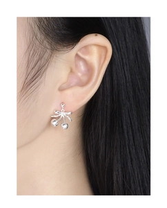 Close-up of S925 silver cherry bow earring on model ear showing sweet delicate design