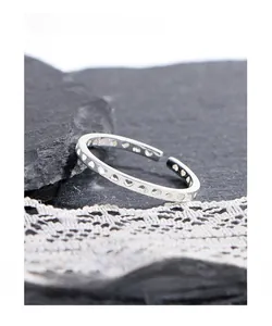 Macro shot of S925 sterling silver ring showing hollow heart pattern and hallmark