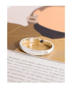 Detail of S925 sterling silver stamp on the inner band of the minimalist open ring