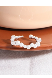 Detailed view of S925 sterling silver beaded wave ring with adjustable open band