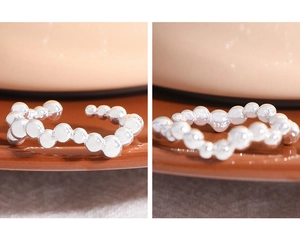 Detailed macro view of S925 sterling silver beaded ring with adjustable open design