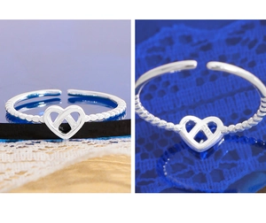 Macro detail of S925 sterling silver stamp on minimalist hollow heart open ring