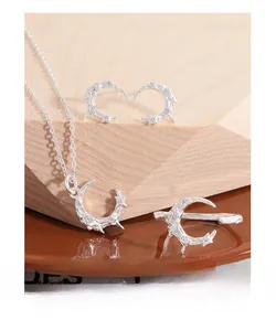 Detailed view of S925 silver moon jewelry set with lava texture and zircon stones