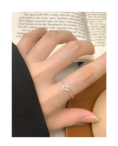 On-finger view of a S925 sterling silver hollow heart ring with beaded band texture