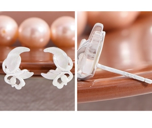 Detailed view of S925 sterling silver stamp on minimalist moon stud earrings