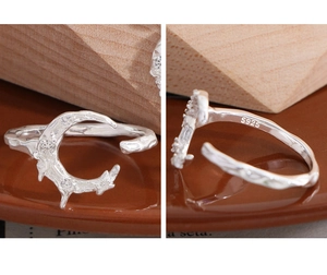 Detailed macro view of S925 sterling silver moon ring with zircon and textured finish