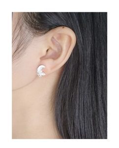 Detailed side view of S925 sterling silver butterfly stud earring on model ear lobe
