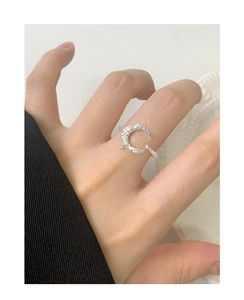 Close-up of textured S925 silver crescent moon ring with sparkling zircon stones