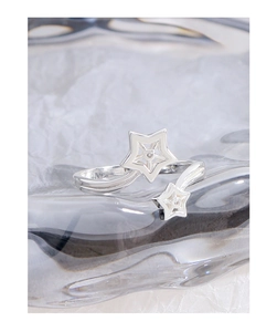 Macro shot of S925 sterling silver bypass ring with sparkling zircon star details