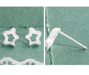 Macro view of S925 sterling silver stamp on minimalist hollow star stud earrings