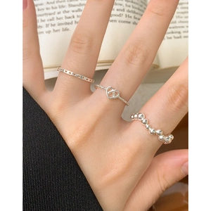 Three-piece S925 sterling silver ring set featuring hollow heart and wave bead designs