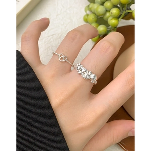 Elegant set of two hollow heart S925 sterling silver rings displayed on hand