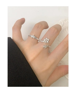 Macro detail of S925 sterling silver adjustable ring with shooting star zircon design