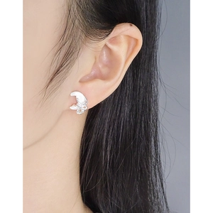S925 sterling silver butterfly earrings with white shell inlay worn by a model