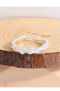 Macro detail of S925 sterling silver ring showing molten lava texture and hallmark stamp