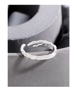 Macro shot of S925 sterling silver ring showing irregular lava texture and hallmark