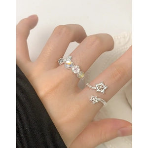 S925 sterling silver star and heart wing ring with opal stone shown on hand