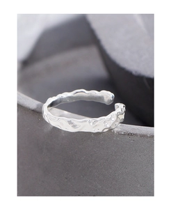 Close-up of S925 sterling silver ring featuring a unique molten lava texture surface