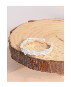 Detail of S925 sterling silver ring showing irregular lava texture and inner hallmark
