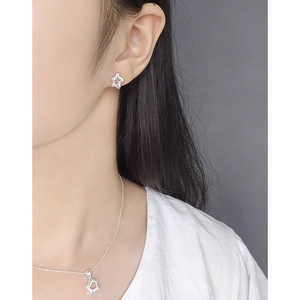 Minimalist S925 sterling silver hollow star earring and necklace set worn by model