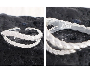 Macro view of S925 sterling silver stamp on twisted double-layer braided ring