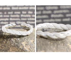 Macro detail of S925 sterling silver twisted ring showing the hallmark engraving