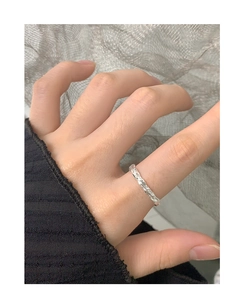 Detailed close-up of S925 sterling silver ring featuring liquid lava texture design