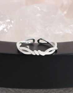 Macro shot of S925 sterling silver stamp on the twisted hollow band of the ring