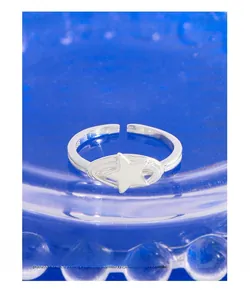 Macro view of S925 sterling silver star ring showing the hallmark and spiral open band