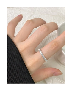 Close-up of S925 sterling silver twisted rope ring worn on finger with a minimalist look
