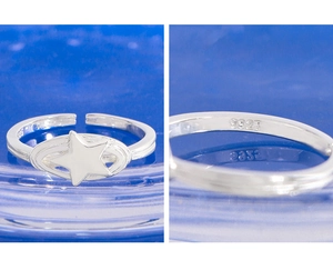 Macro shot of S925 sterling silver star ring showing adjustable band and material hallmark