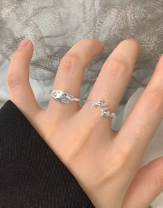 Close-up of S925 sterling silver star ring set with spiral and open band designs