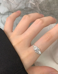 Detailed macro view of S925 sterling silver spiral ring with a hollow star design