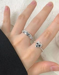 Detail of vintage silver rings with star and moon engravings and heart shaped design