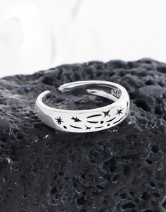 Macro shot of S925 sterling silver stamp and engraved star patterns on ring band