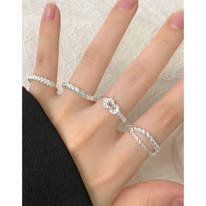 Minimalist S925 sterling silver twisted interlocking rings for women worn by model