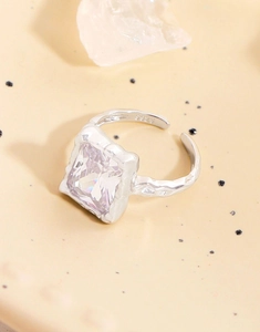 Detailed view of S925 silver ring featuring square zircon and lava texture finish