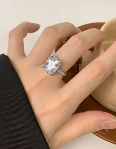 Macro detail of S925 silver ring featuring lava texture and clear square zircon