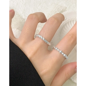 S925 sterling silver twisted rope and beaded stackable rings set on a model hand