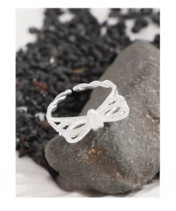 Detail shot of silver S925 butterfly bow ring with double-layer twisted rope texture