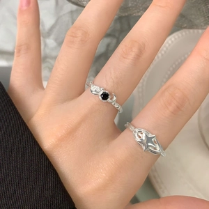 S925 sterling silver spiral star rings set with black gemstone on woman's finger