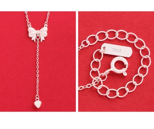Detail of S925 sterling silver stamp on the heart bow pendant necklace clasp