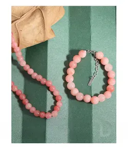 Detail of S925 sterling silver tag and natural pink agate beads necklace set